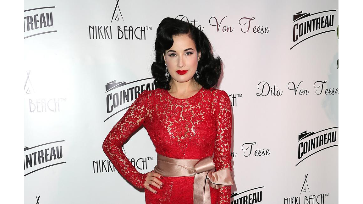 Dita Von Teese relies on gun tool to ease he back pain 8days