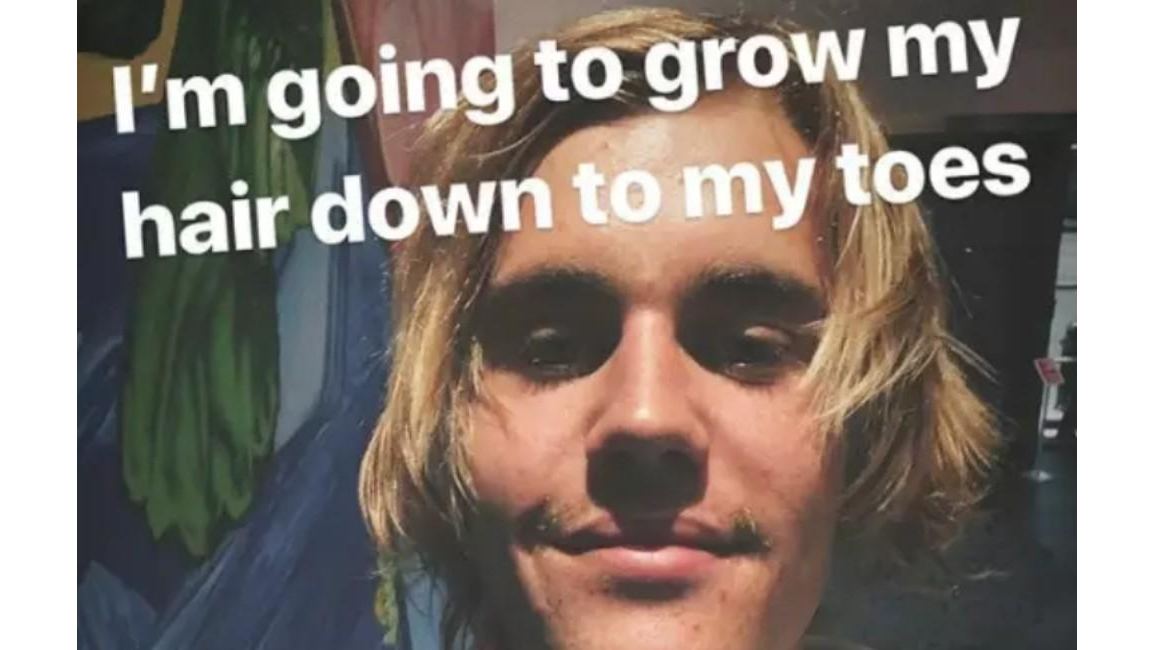 Justin Bieber loves his long hair - 8 Days