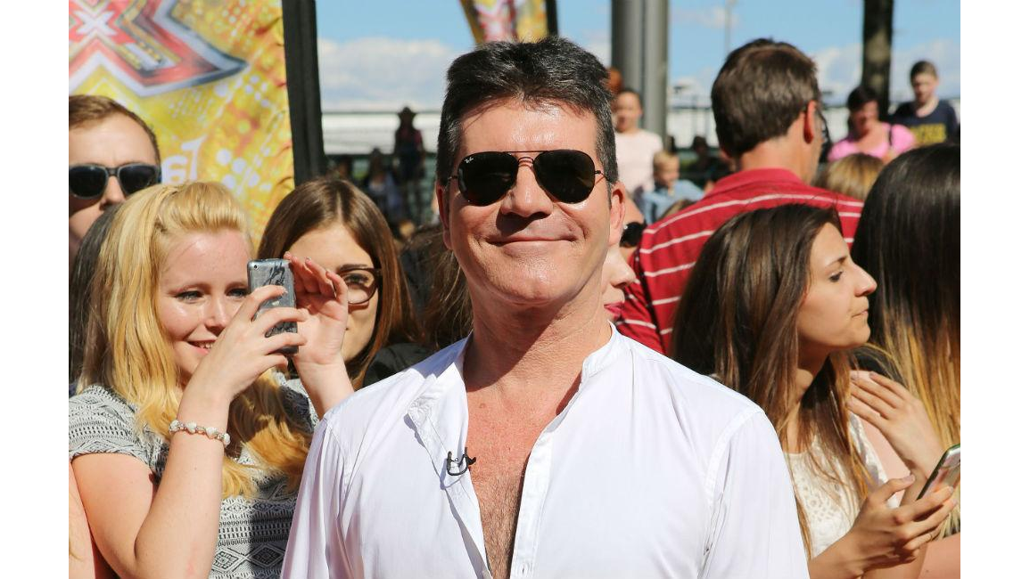 Simon Cowell's Son Eric 'shares His Charm' - 8days