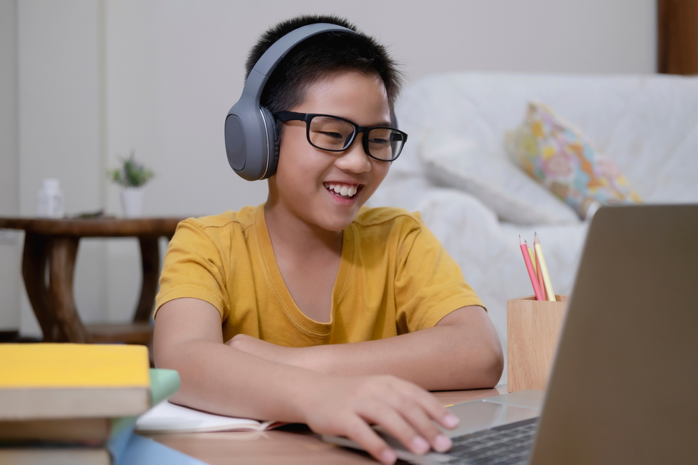 boy engaged in online learning