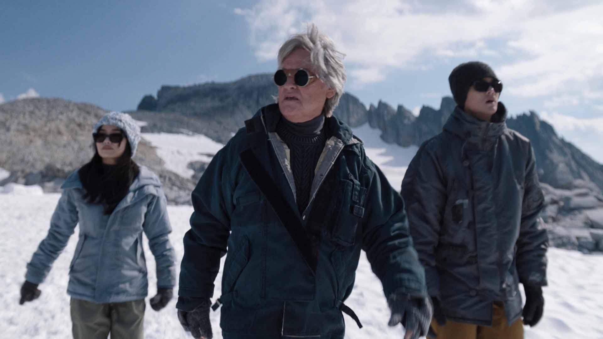 Ice view: Kurt Russell with Anna Sawai and Ren Watabe in the 'Parallels and Interiors' episode, which was filmed on an actual glacier, Mount Breakenridge in British Columbia, Canada. Did shooting the ep bring back memories of filming 1982's The Thing? "Absolutely," said Kurt. "We flew up every day in a helicopter and you put it all together — helicopter, white out, ice, glacier...yeah, it took me back whatever 40 plus years." 

