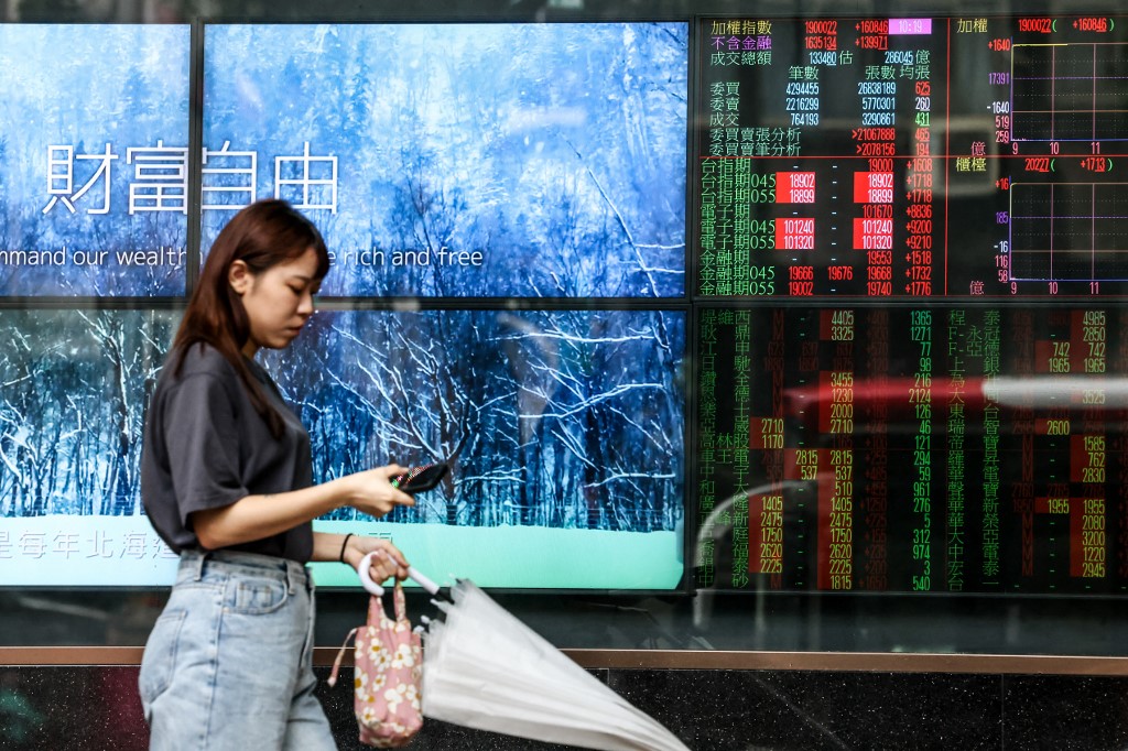 Most stocks rise as Fed hikes and indicates drive to curb inflation