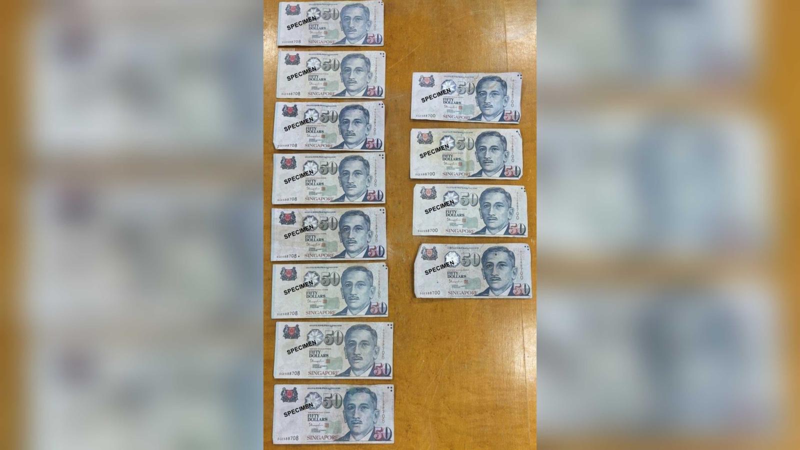 Two men to be charged with use, possession of counterfeit S$50 notes