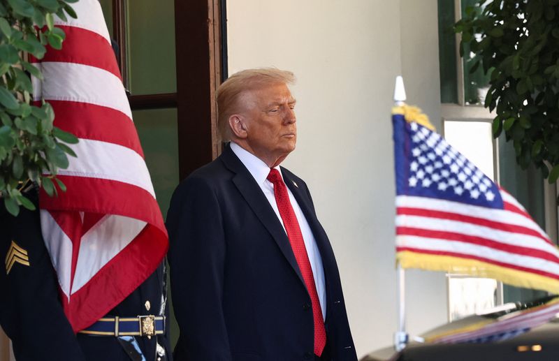 Trump says China 'doesn't want' to invade Taiwan, plans China visit next year
