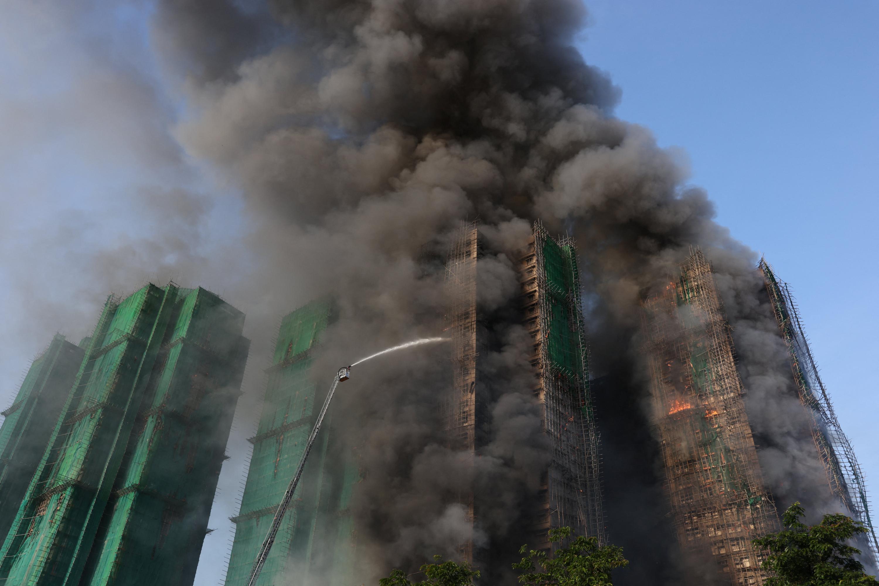 Four dead after fire engulfs residential high-rise buildings in Hong Kong
