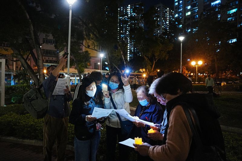 Hong Kong mourns victims of blaze that killed 128 and counting
