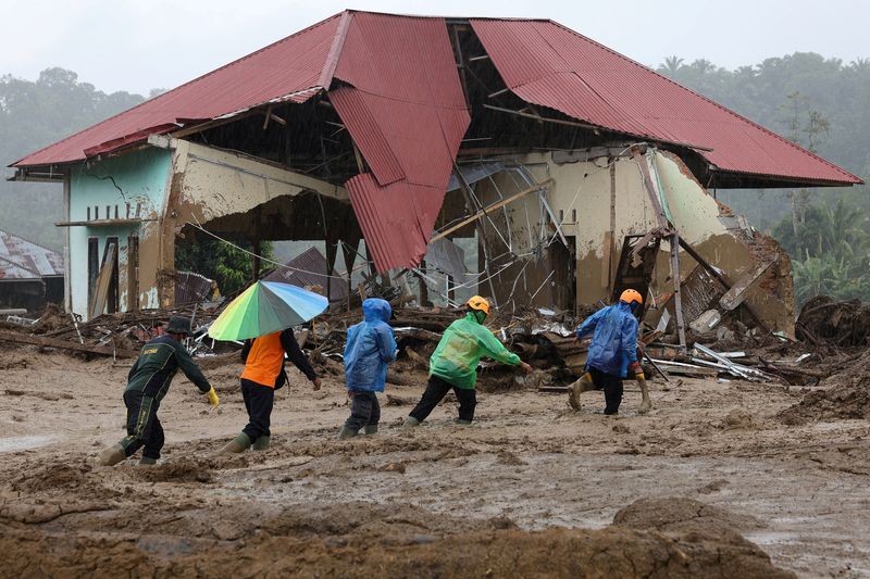 Aid groups grapple with shrinking funds, infrastructure damage in flood-hit Asia