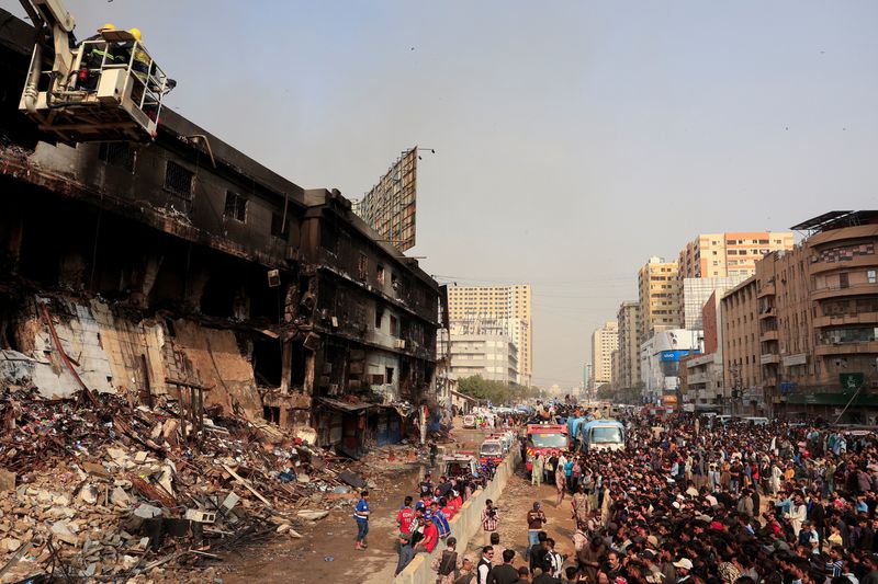 Karachi mall fire death toll rises to 23 as rescuers search for dozens missing