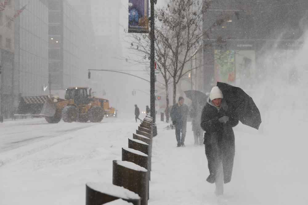 US sees more snow from the tail end of a colossal winter storm, at least 25 deaths reported