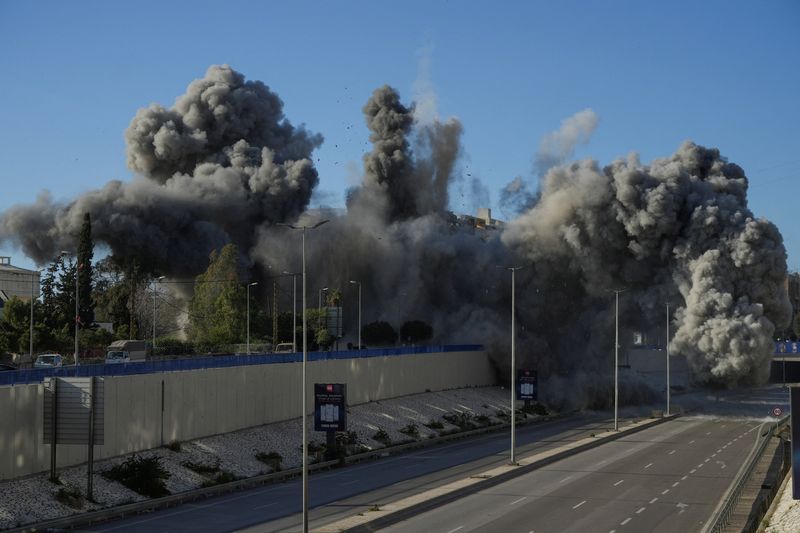 Israel says striking Hezbollah sites in Beirut after destroying bridge