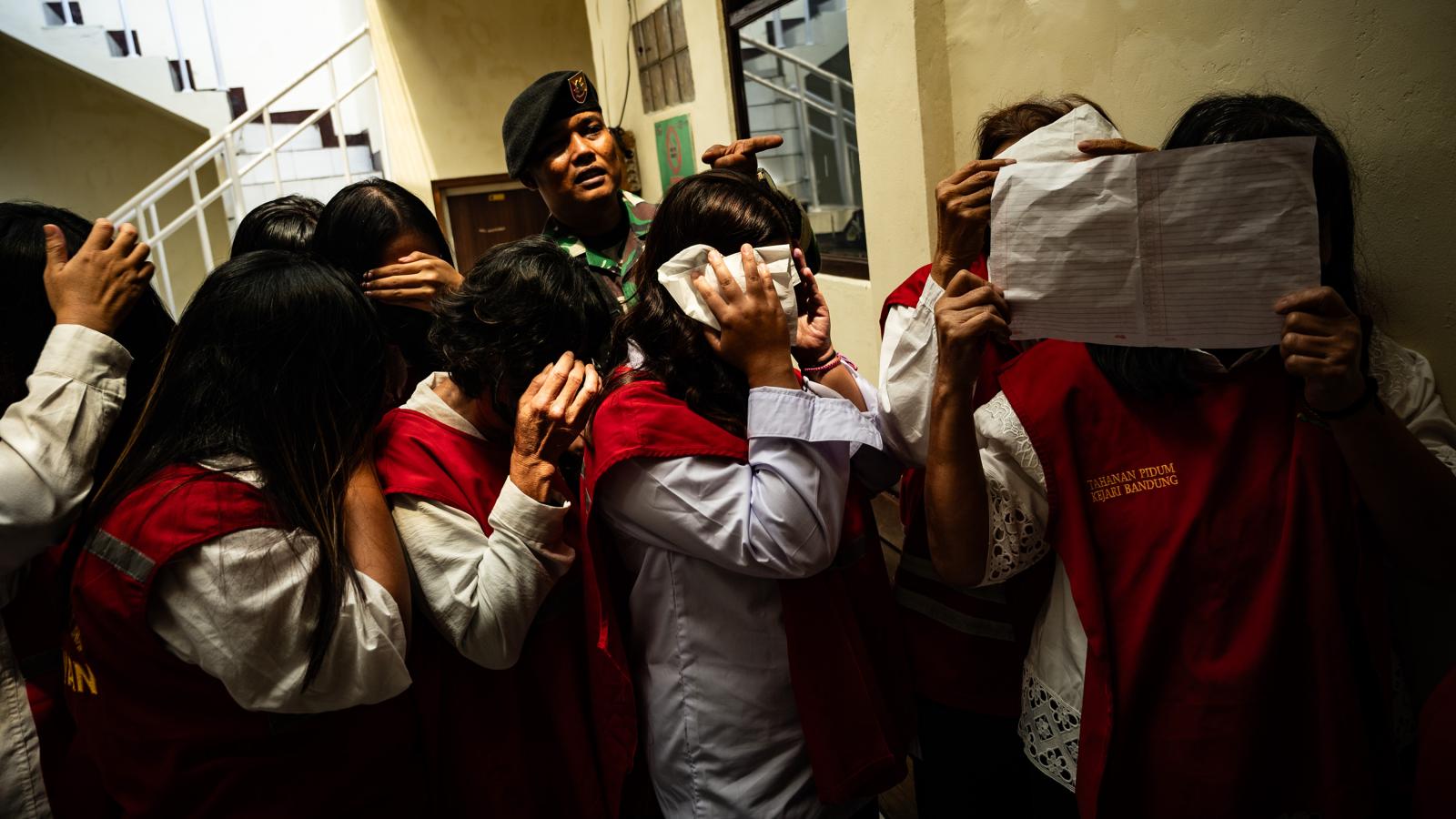 Indonesia baby trafficking trial begins for 19 people accused of sending at least 10 newborns to Singapore