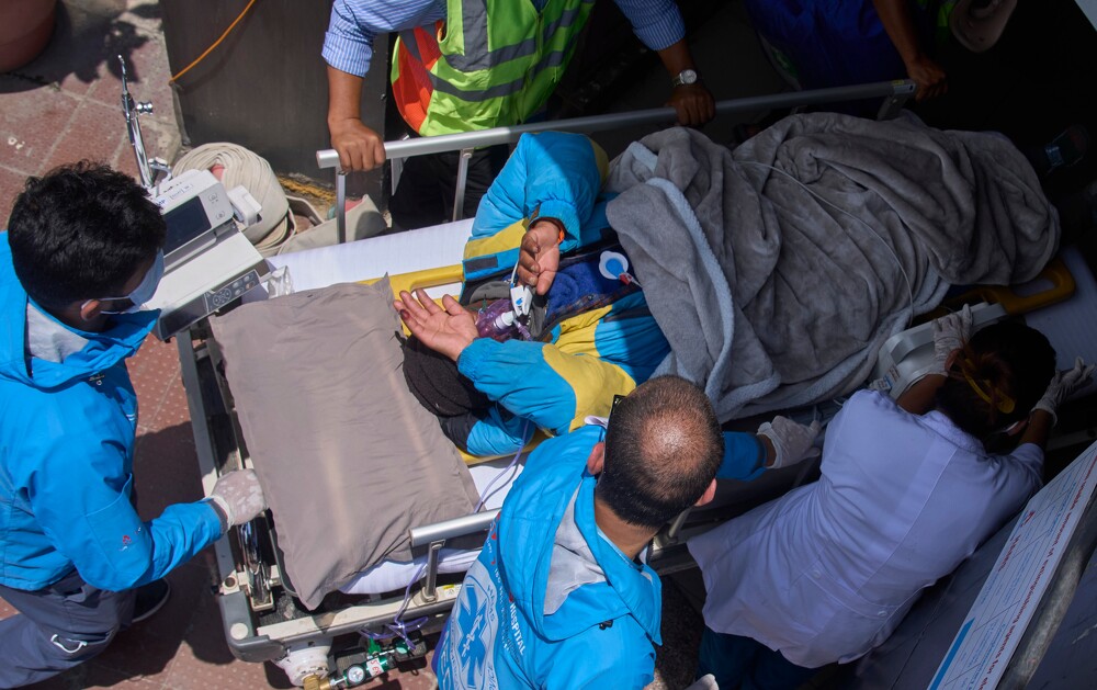 Family questions rescue efforts for Sherpa guide found alive on Everest, seeks legal action