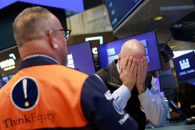 Stocks slide on US inflation surge, tech weakness