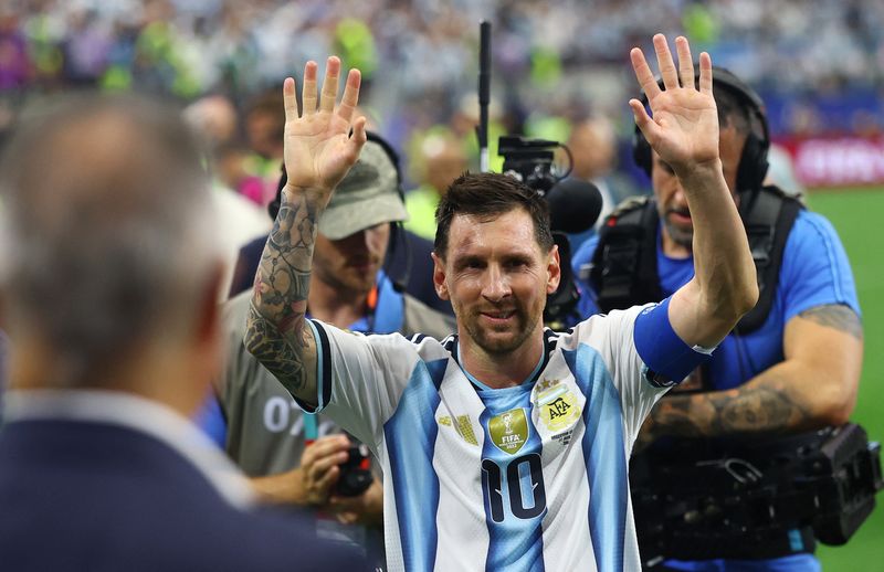 Milestone Messi sends Argentina to World Cup knockout stage