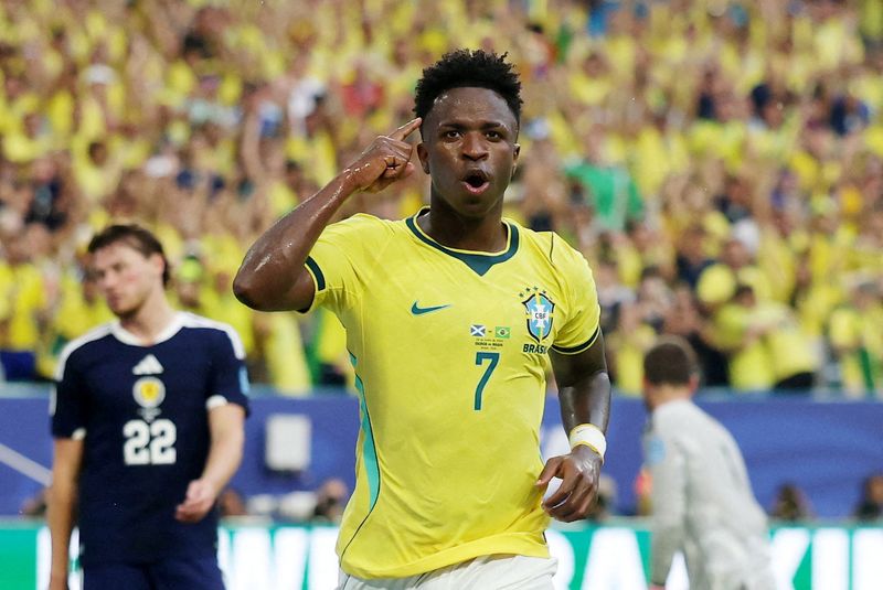 Vinicius fires Brazil into World Cup knockouts with 3-0 win over Scotland