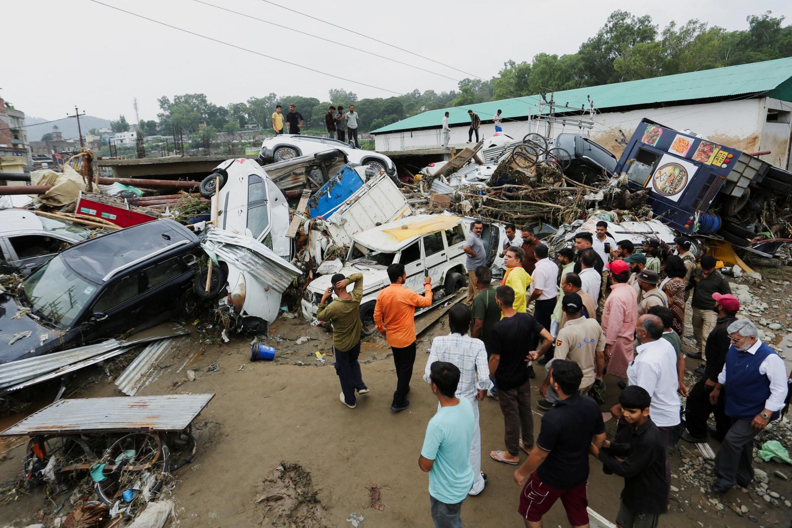 India floods and landslides kill at least 19