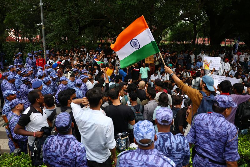 Indian police fire tear gas at exam protest march
