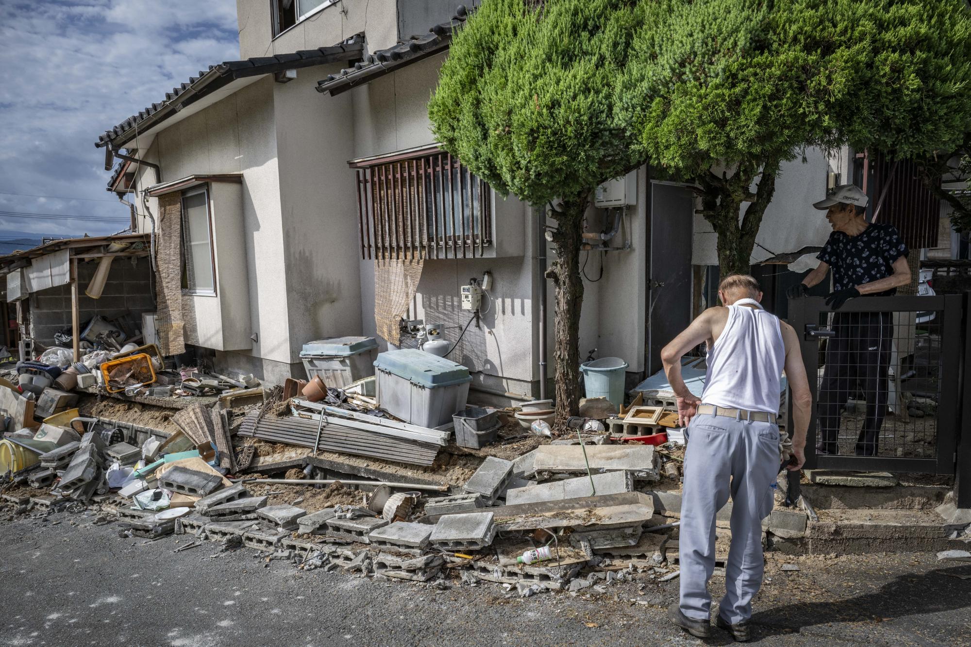 Rescuers in Japan haul survivors from collapsed mall as earthquake toll rises to 13
