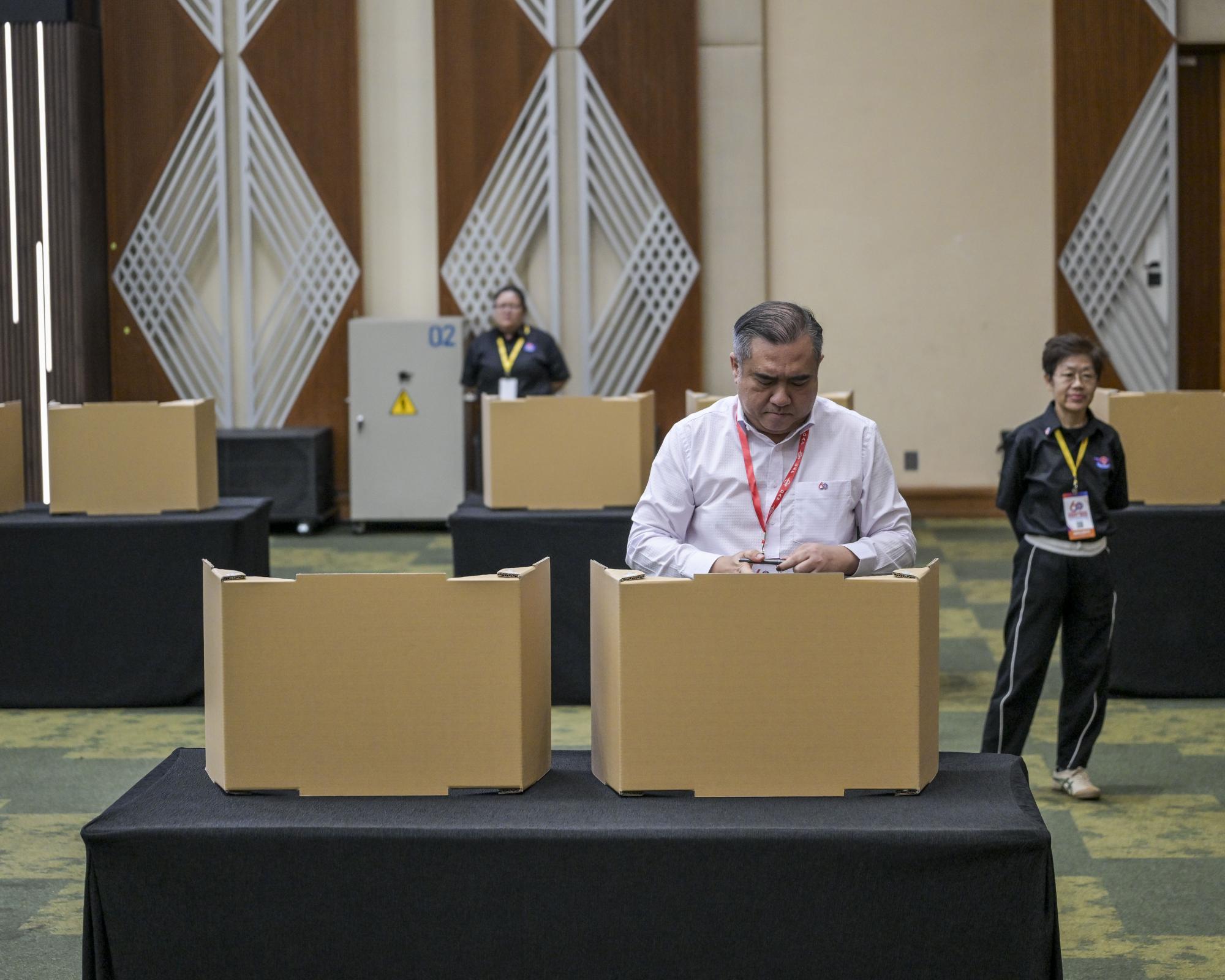 Malaysia’s DAP votes overwhelmingly to stay on in Cabinet, offering reprieve to PM Anwar