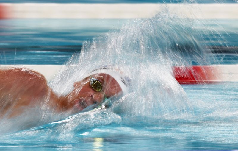 Marchand still the home hero in Paris as new record breakers emerge