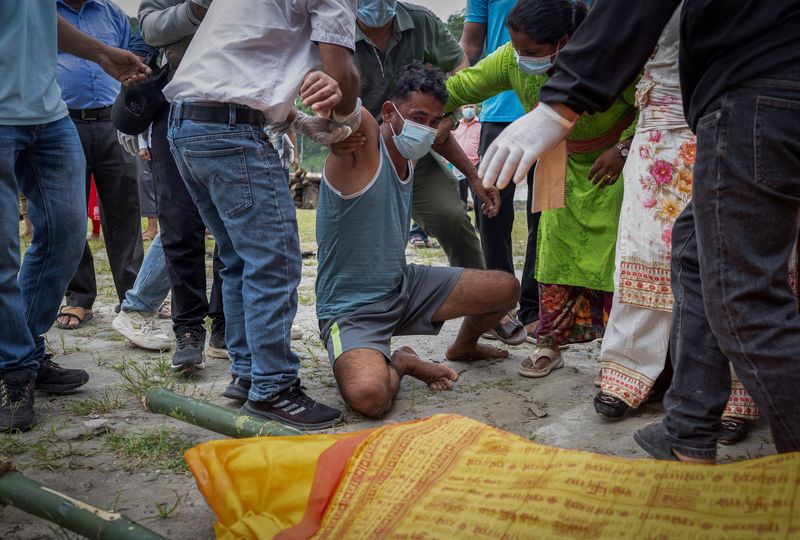 Nepali families hold symbolic funerals for missing after floods