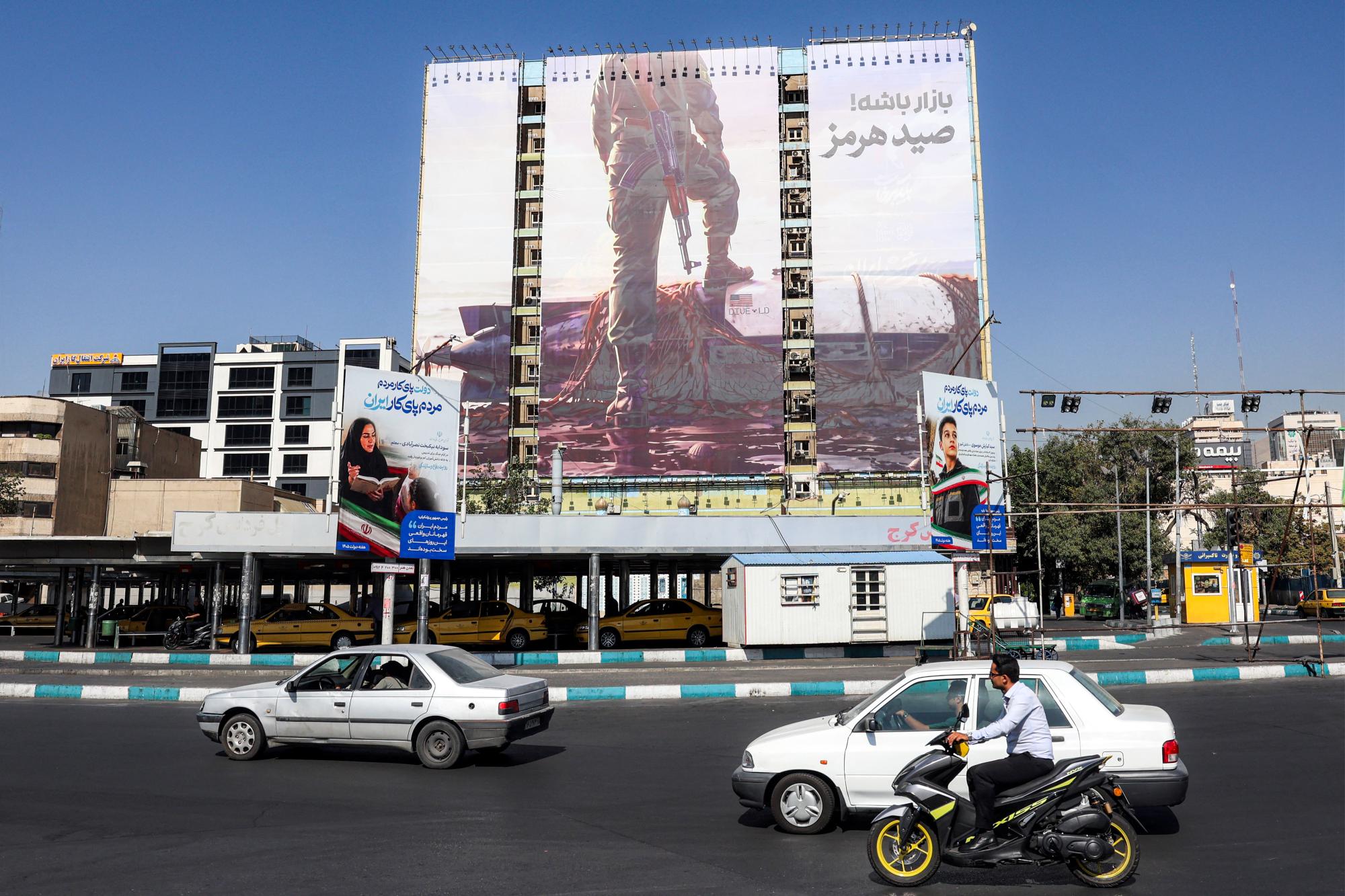 Iran threatens new strikes as it awaits US response to Hormuz plan