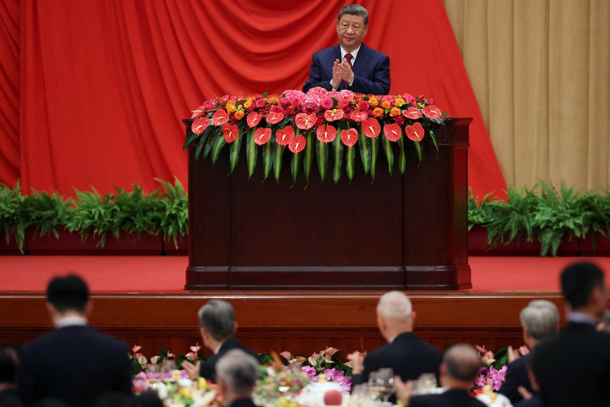 Marking China's national day, Xi calls for progress towards reunification with Taiwan