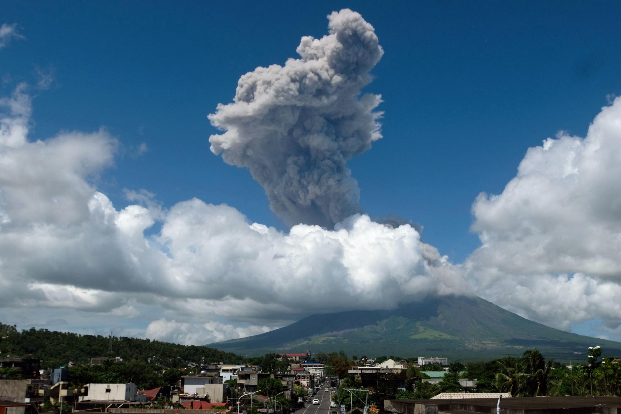Philippines raises volcano alert level as blast sends ash skyward